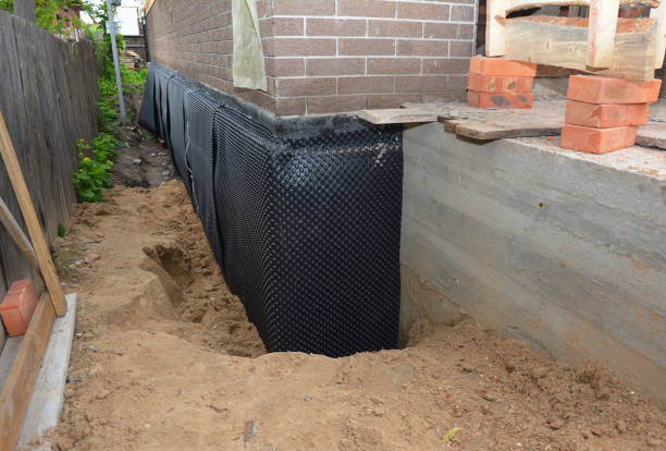 SJ Waterproofing Pros technician performing targeted Waterproofing assessment in Broadway, NC